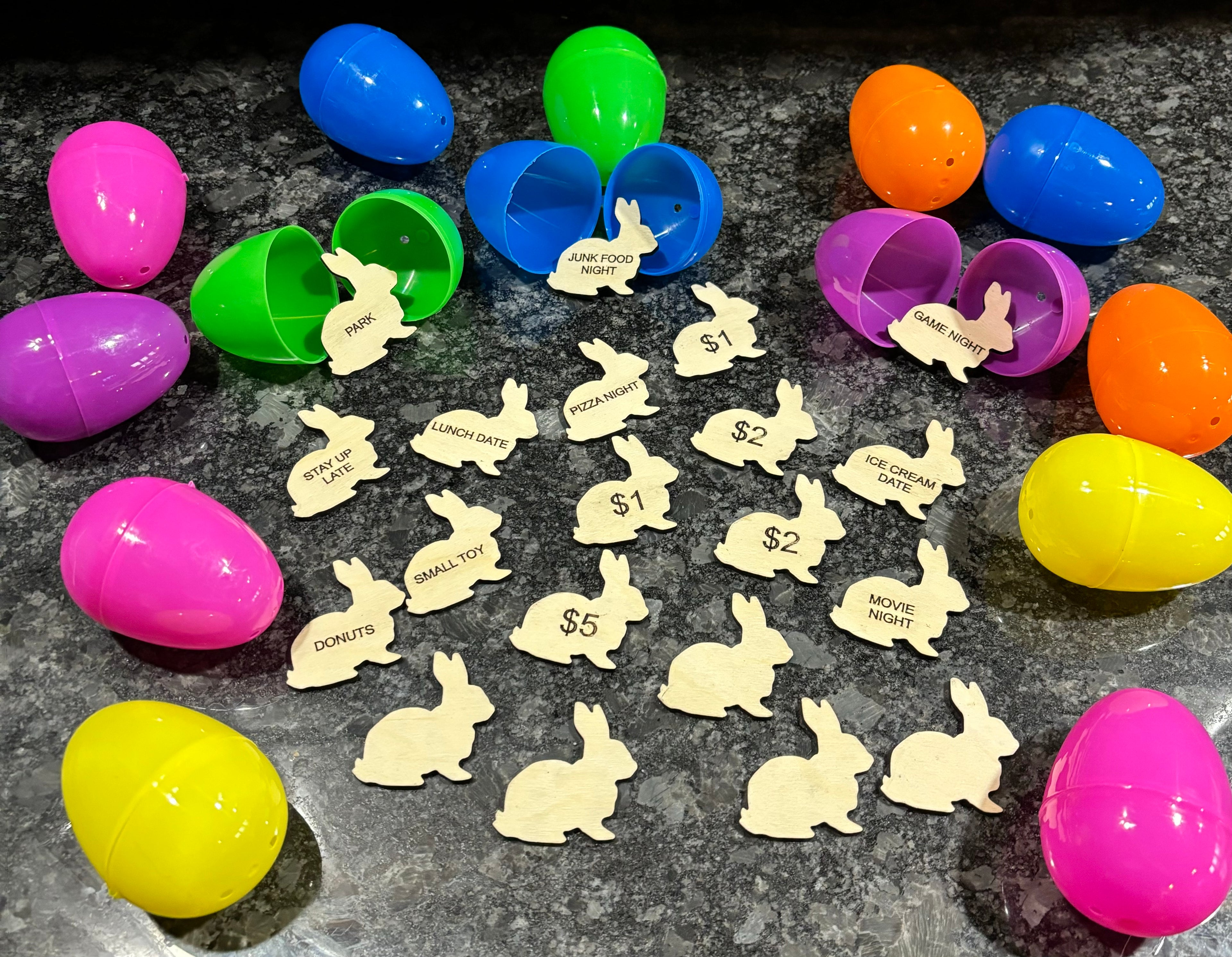 Gold bunny-shaped tokens with $1–$5 labels, surrounded by colorful Easter eggs