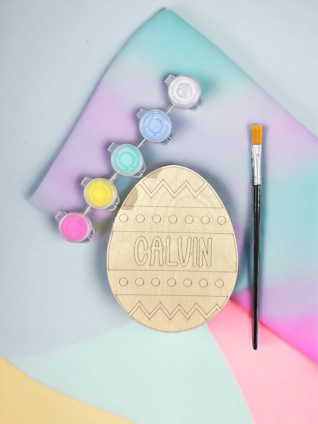 Wooden Easter egg ornament with CALVIN lettering, paint pots and paintbrush included