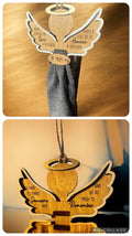 Hanging angel ornament with wooden wings, round halo, and dark fabric skirt