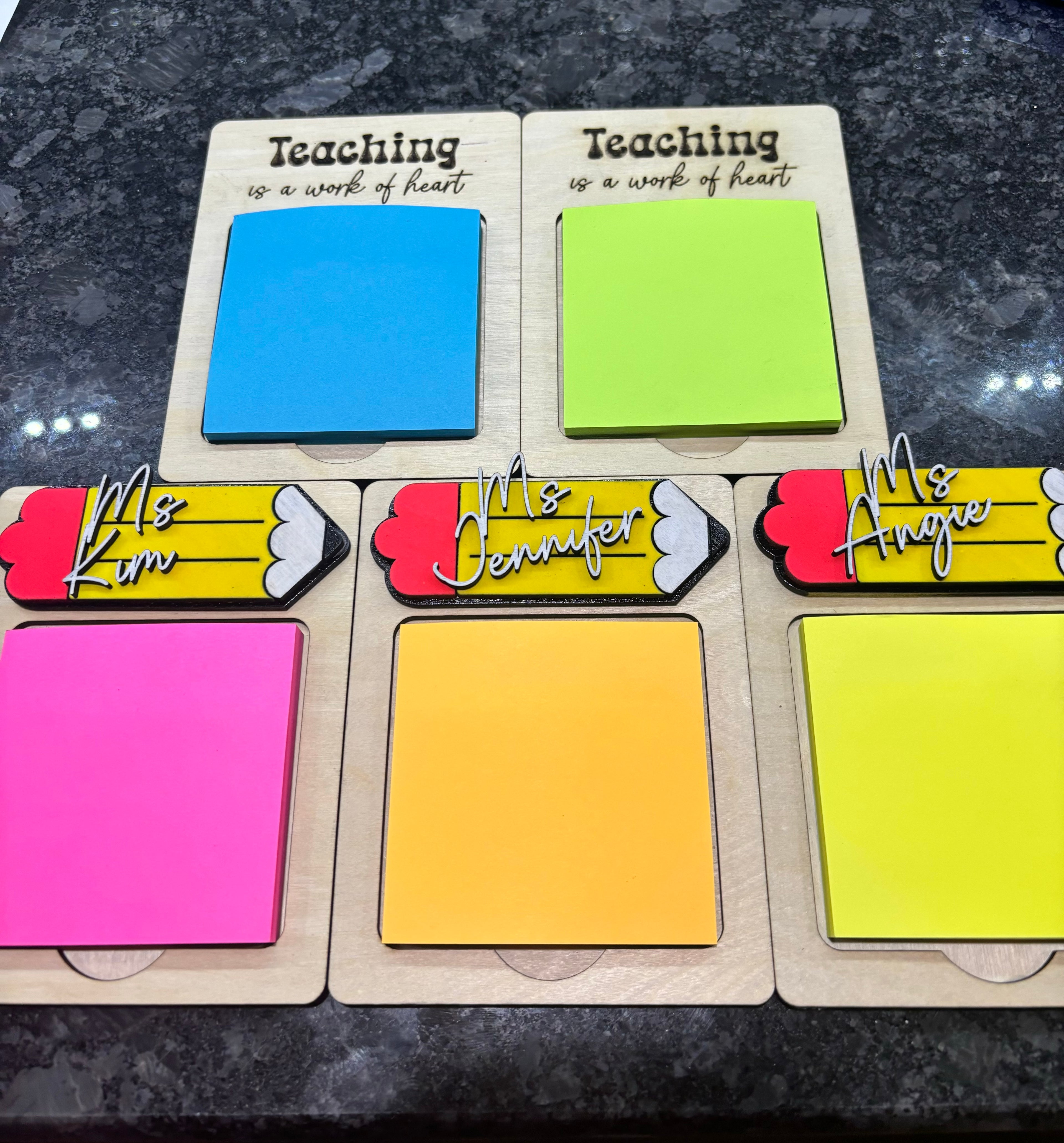 Teacher note holders with kraft cards and colorful sticky notes, reading “Teaching is a work of heart”