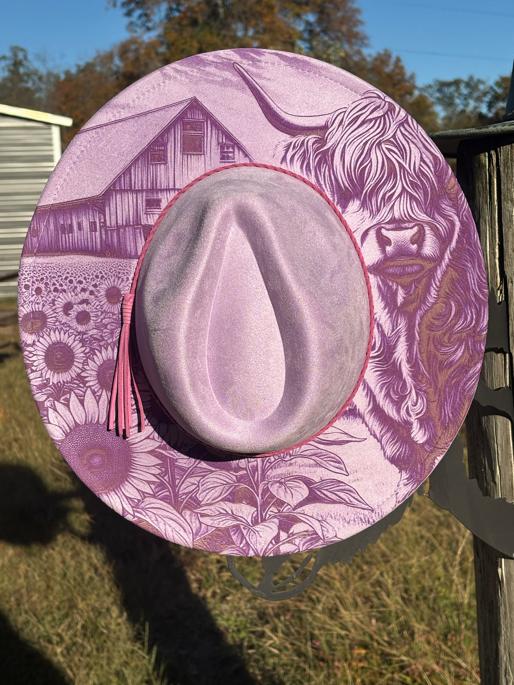 Engraved suede fedora hat in lilac with animal and floral artwork around the brim