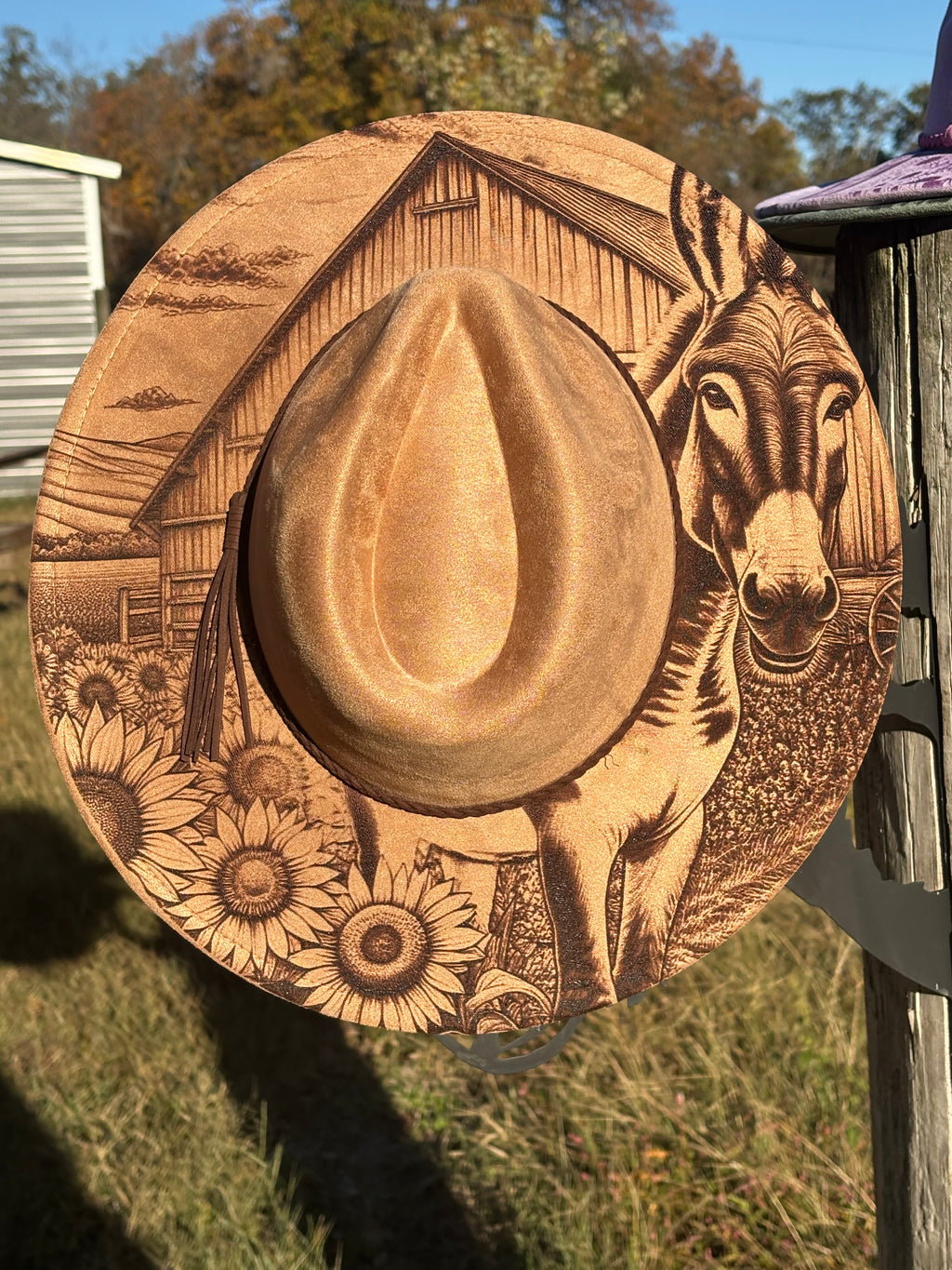 Tan suede hat with engraved barn and dog portrait, wide brim