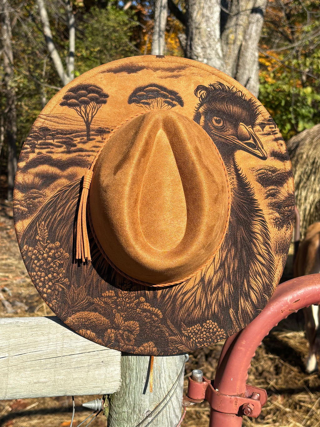 Engraved suede fedora hat in warm tan with engraved bird and tassel detail