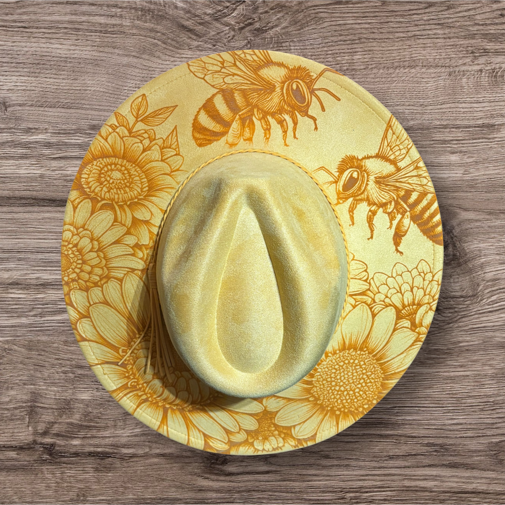 Yellow suede hat with engraved bee and floral pattern, satin-like crown
