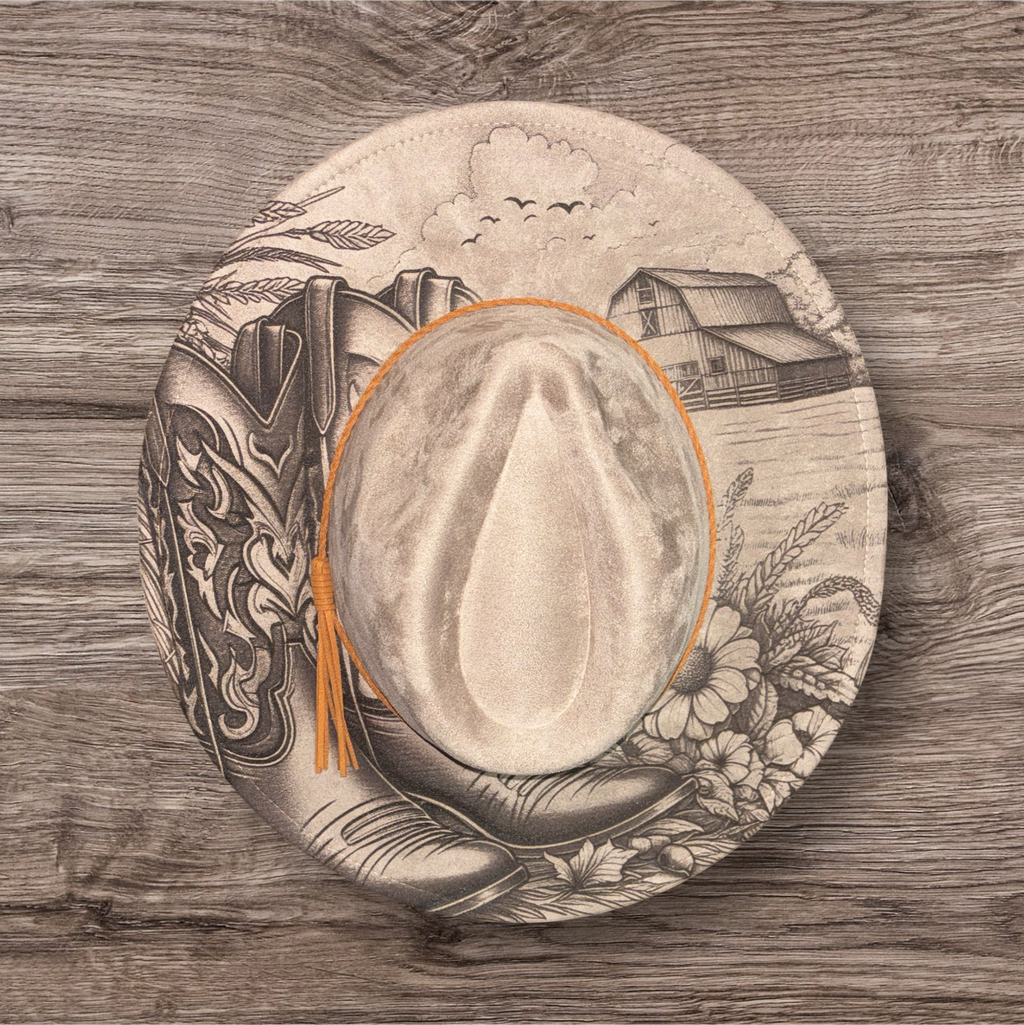 Beige suede hat with engraved farmhouse scene and birds, wide brim