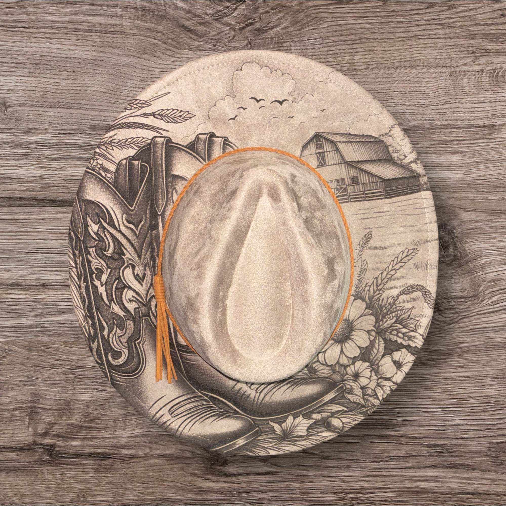 Beige suede hat with engraved farmhouse scene and birds, wide brim