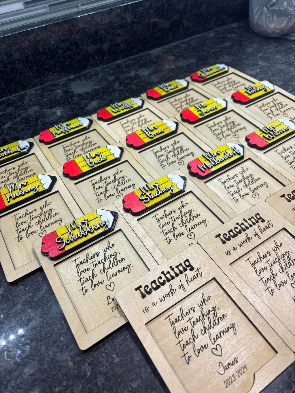 Assorted teacher note holders with kraft cards, heart name tags, and colorful sticky notes