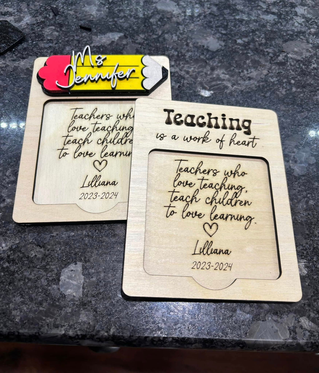 Two teacher note holders with “Teaching is a work of heart,” personalized names, and sticky notes