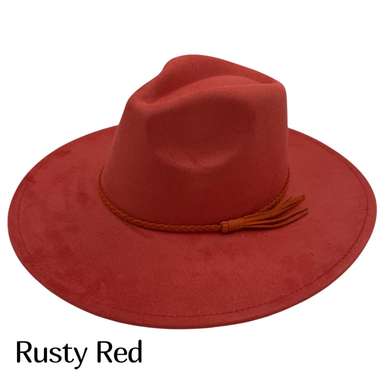 Suede fedora hat in rusty red with braided band and tassel detail